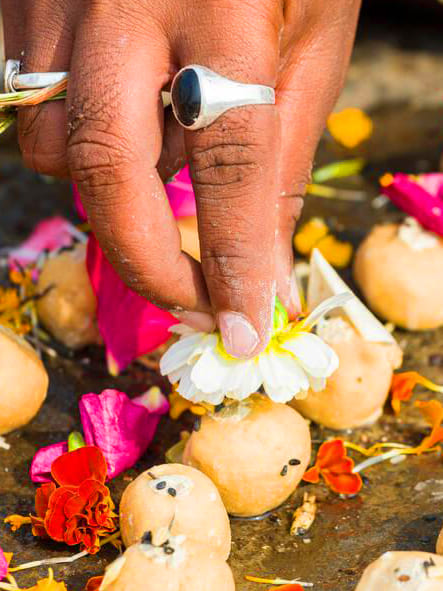 Pind daan ritual for pitra dosh nivaran performed in Trimbakeshwar with offerings and flowers